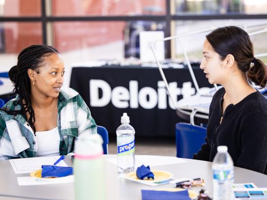 Accounting students meet with Deloitte representatives to discuss career opportunities. 