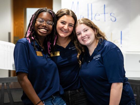 Resident assistants at St. Edward’s University posing for a photo at student residential hall.