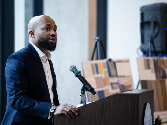 Linus Akanoh, Jr. ‘06 speaking at the grand opening for the School of Health Sciences reception.