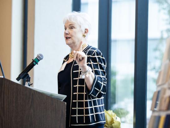 Cindy Kozmetsky ‘95 speaking at the grand opening for the School of Health Sciences reception.
