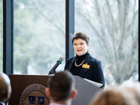 Donna Beuk speaking at the grand opening for the School of Health Sciences reception.