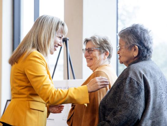 The Ladies of Charity of Austin check signing presentation in the Munday Library.
