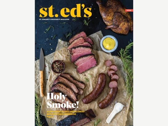 A table full of smoked meats- brisket, steak, sausage, chicken, and some spices