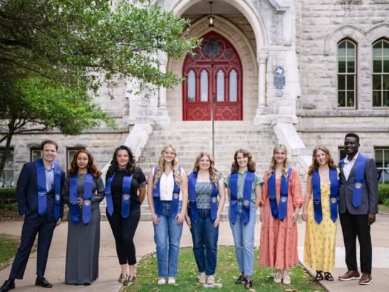 Presidential award winners from 2024 posing for a picture outside main building