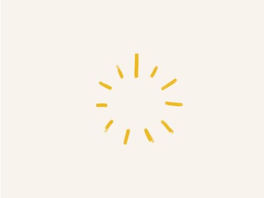 A gold sunburst shape with different sized lines in a circle shape