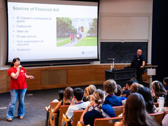 The Director of Financial Aid talking to students about applying for financial aid