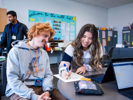 Tutor helping a student in the math lab