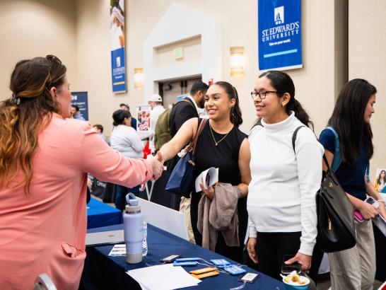 Students meeting a employer at the job fair