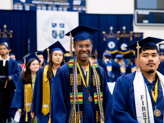 Graduates receiving their diploma