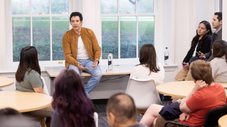 Gabriel Luna talks with students
