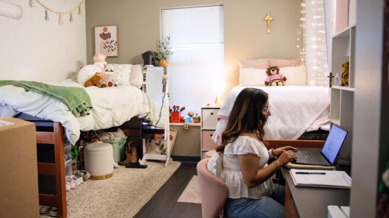 Student studying in her Jacques Dujarié dorm.