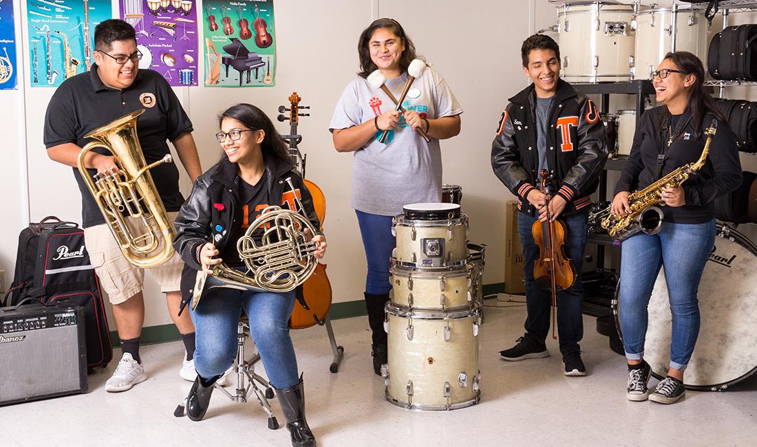 high school student using instruments