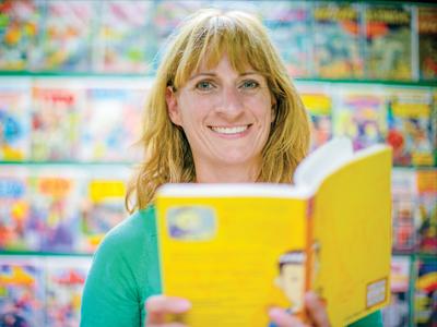Cory Lock holding a yellow book