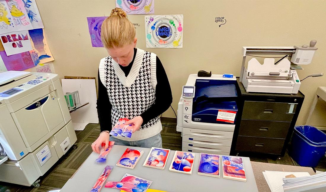 student creating art inspired by the eclipse