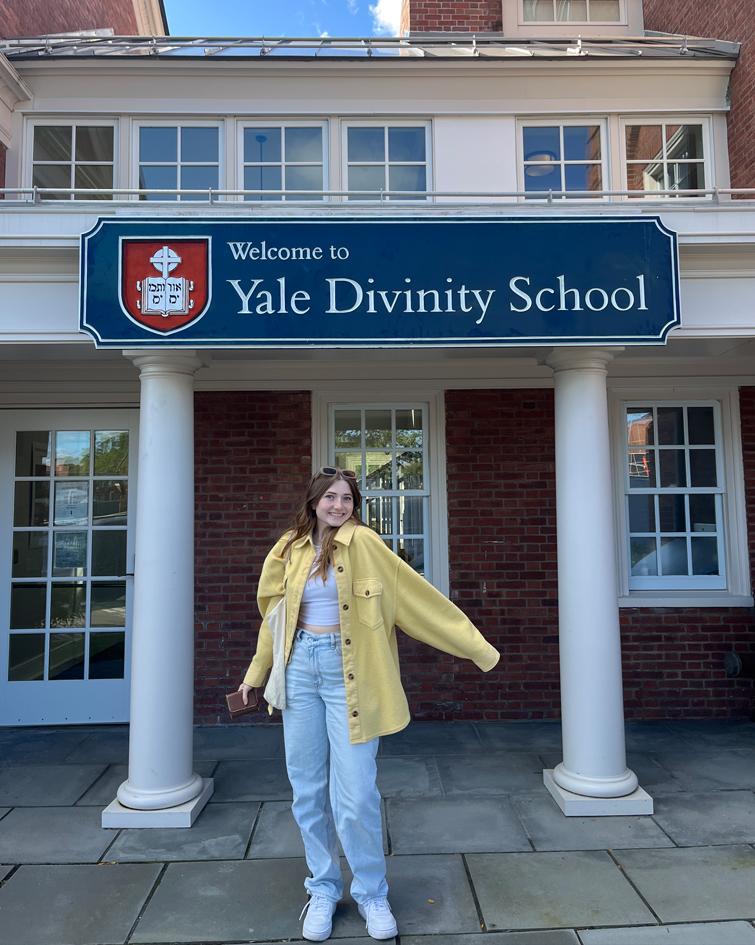 Natalie posing in front of Yale Divinity School