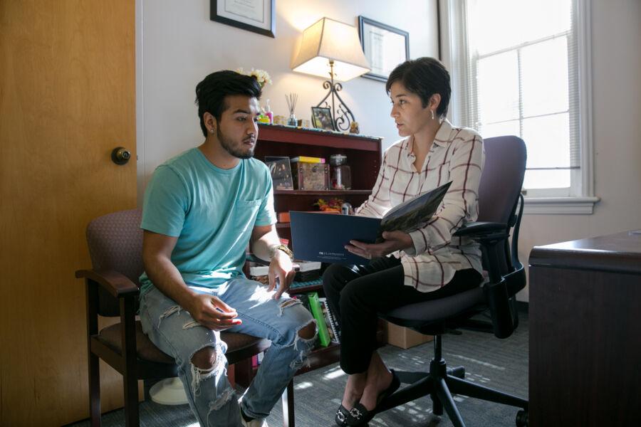 Student meets with his financial aid officer. 