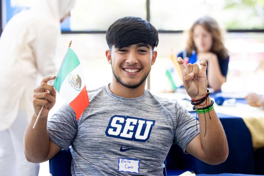 Student posing for a photo at the International Students Family Reception.