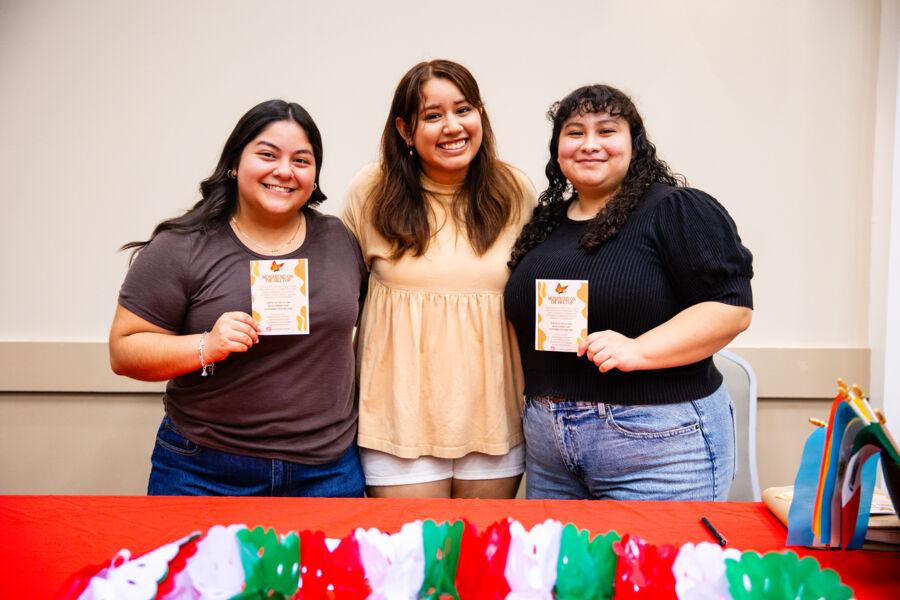 Students celebrating monarchs on the hilltop.