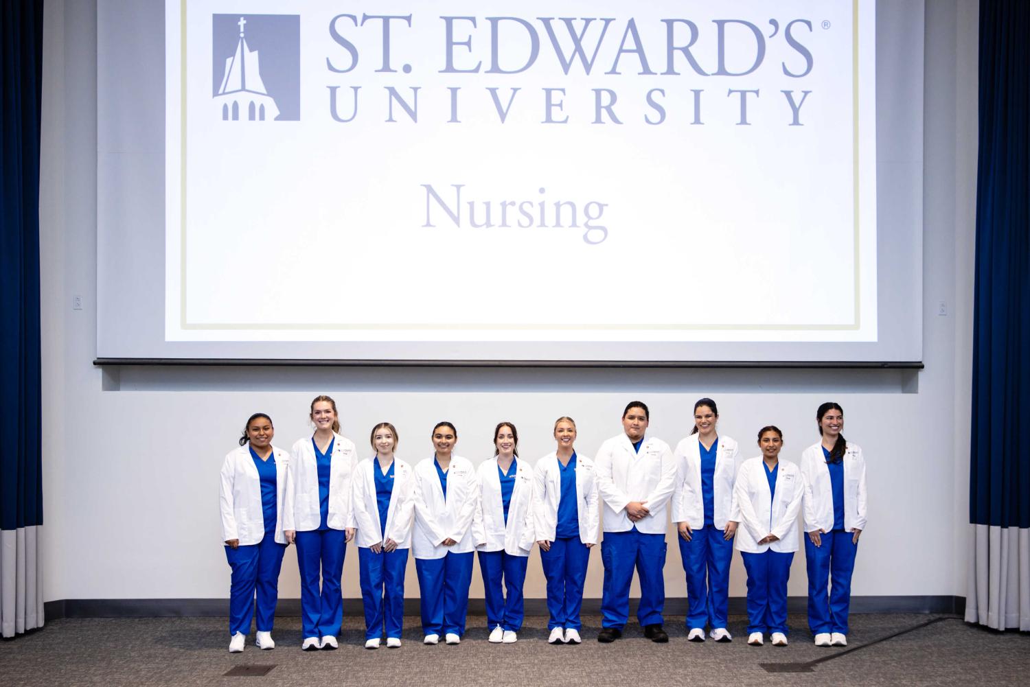 Nursing students receive their white coats at the first-ever White Coat ceremony at St. Edward's.
