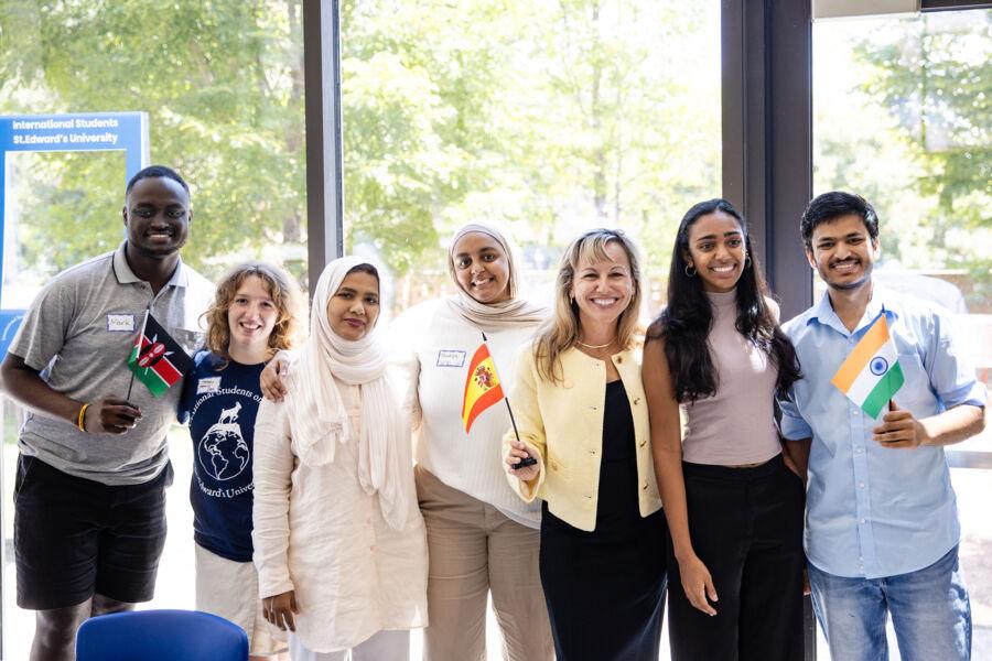 President Montserrat Fuentes posing for a photo with international students.