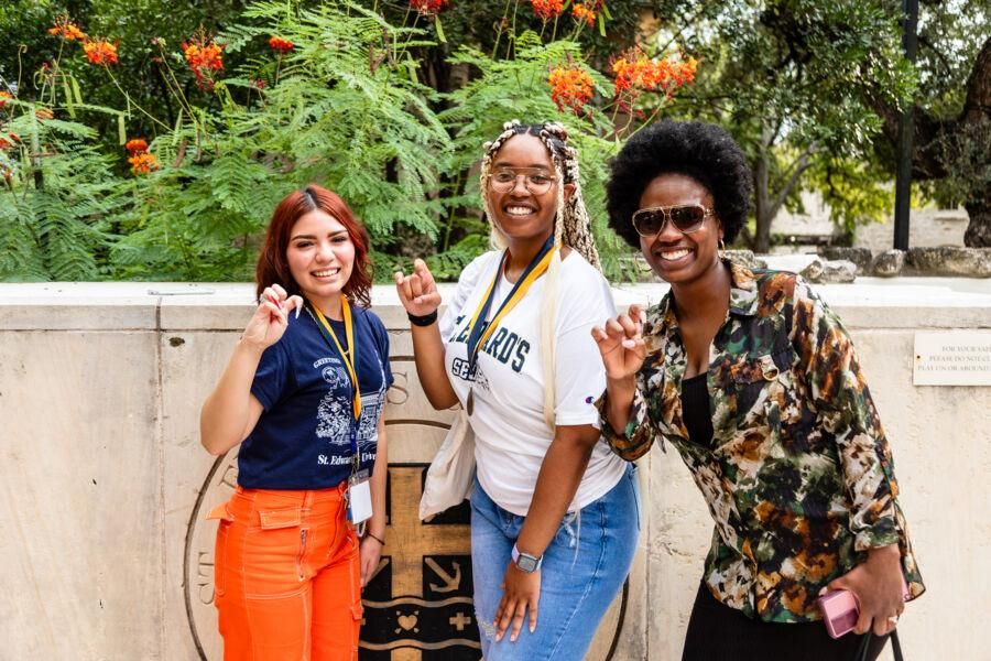 New students posing for a photo with their Medallions during the Legacy Walk.