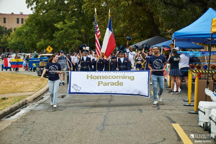 Students participate in the Homecoming 2024 parade in front of Main Building.
