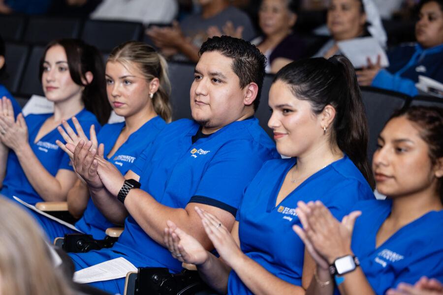 Nursing students receive their white coats at the first-ever White Coat ceremony at St. Edward's.