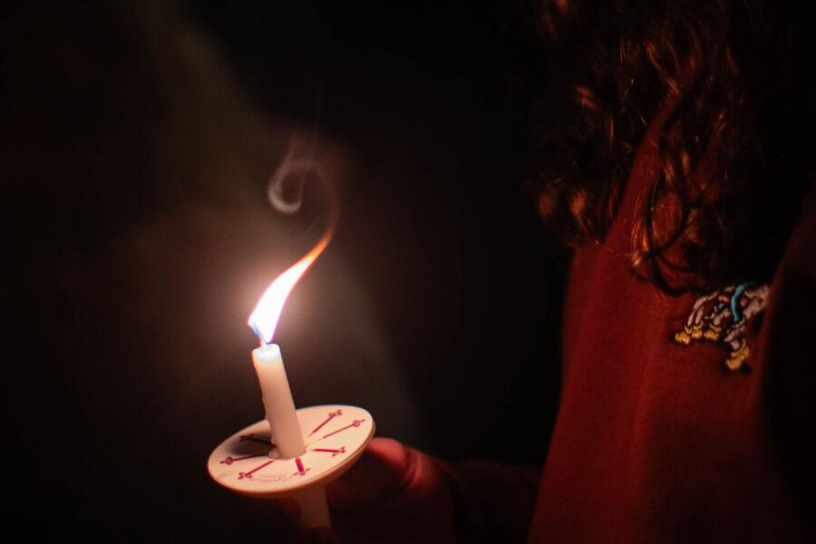 Close up shot of a lit candle at the Festival of Lights.