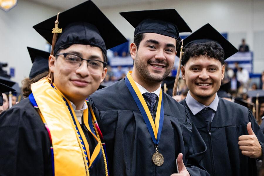 Graduates celebrating their achievement at December Commencement 2024.