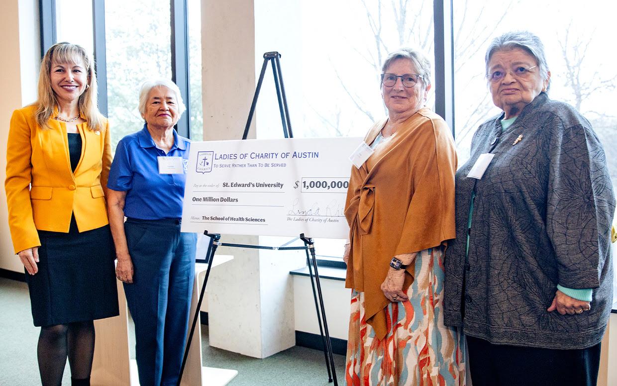 The Ladies of Charity of Austin check signing presentation in the Munday Library.