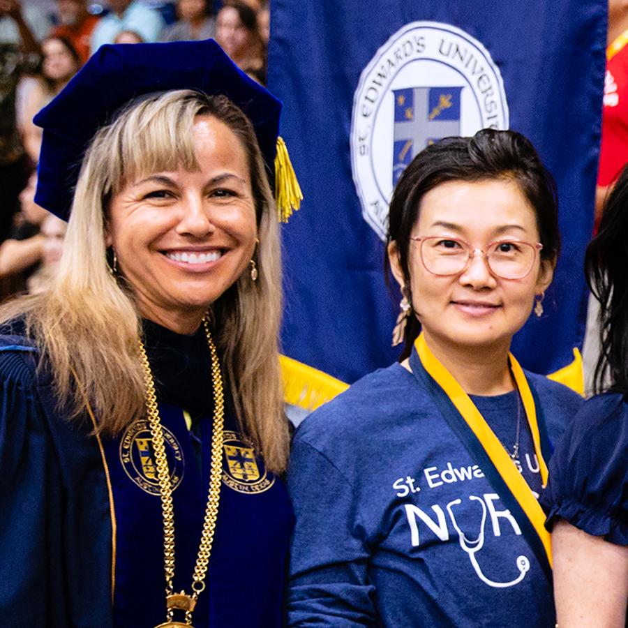Yu Zhong, Assistant Professor of Nursing with President Montserrat Fuentes.