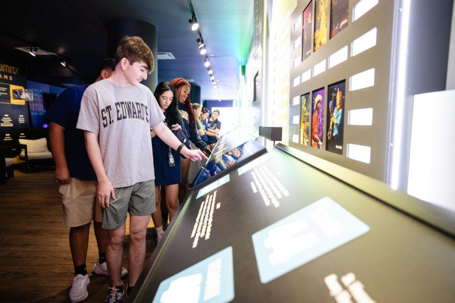 A student interacts with museum components during the ACL Live tour