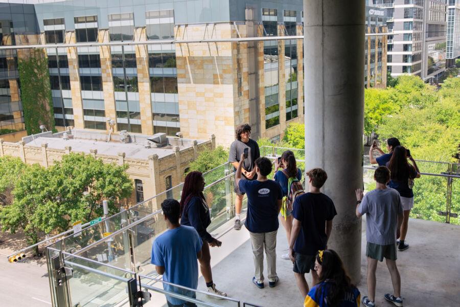 A student poses on the patio deck of ACL Live