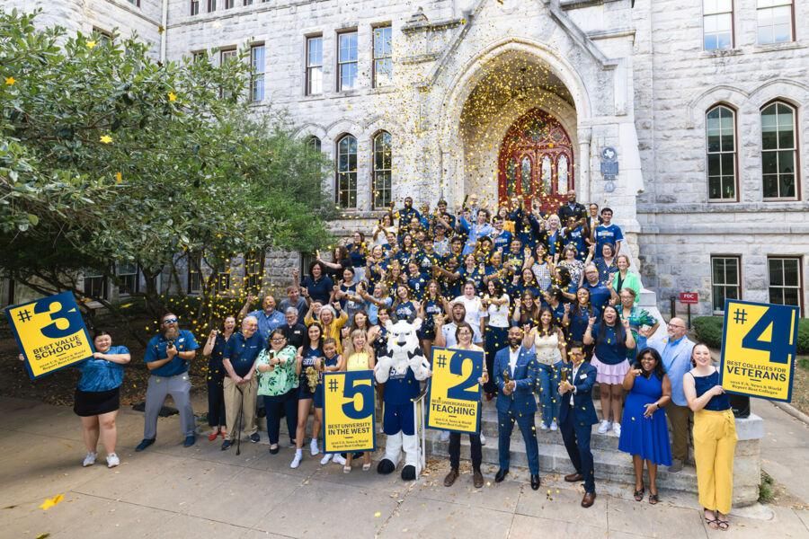 Students, faculty, and staff pose outside of Main Building to celebrate the #5 ranking from US News and World Report
