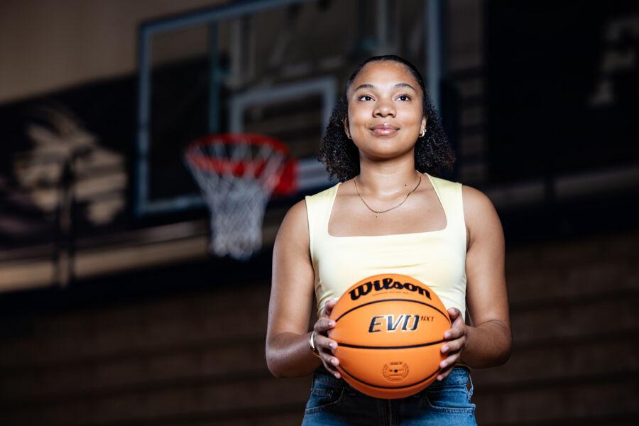 Suni Davis poses with a basketball in the RAC