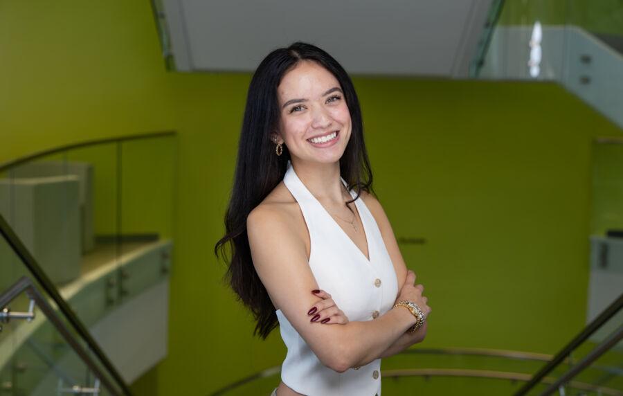 Student Chloe Roque poses in the JBWS stairs