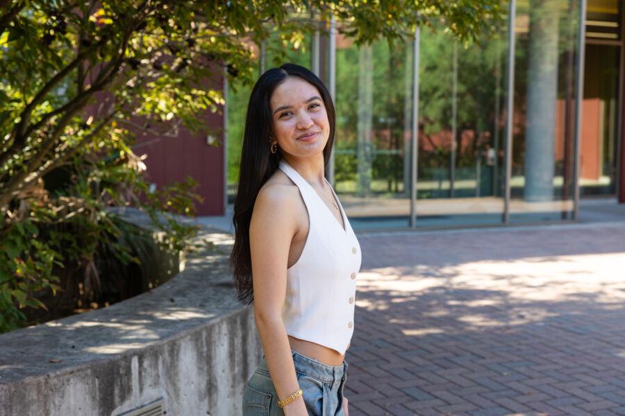 Student Chloe Roque poses in front of JBWS