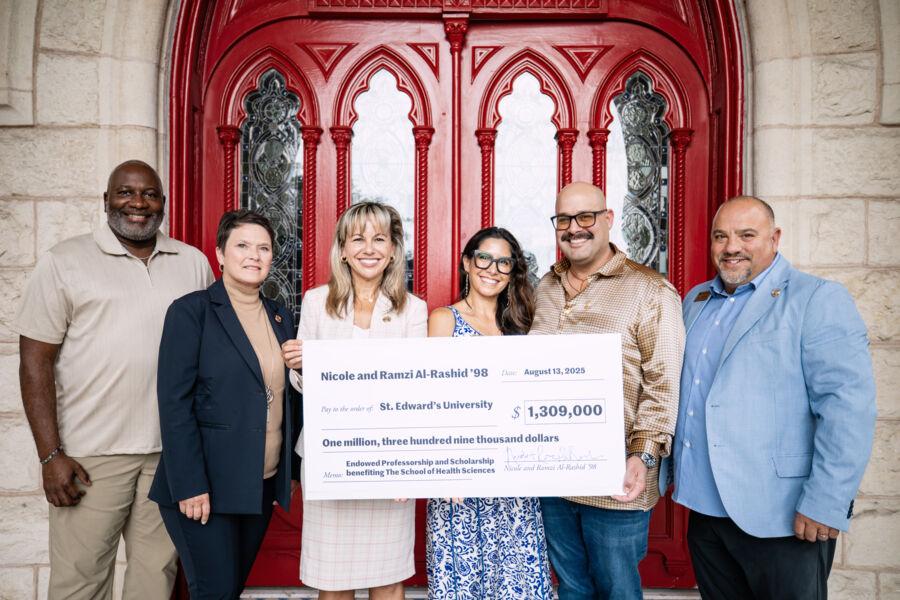 President Montserrat Fuentes joins university officials at Main Building to celebrate as a check is presented to the School of Health Sciences.