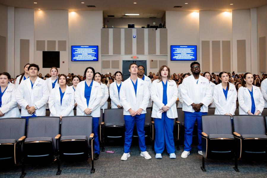 Nursing students celebrate the 2nd Annual White Coat Ceremony in Jones Auditorium.