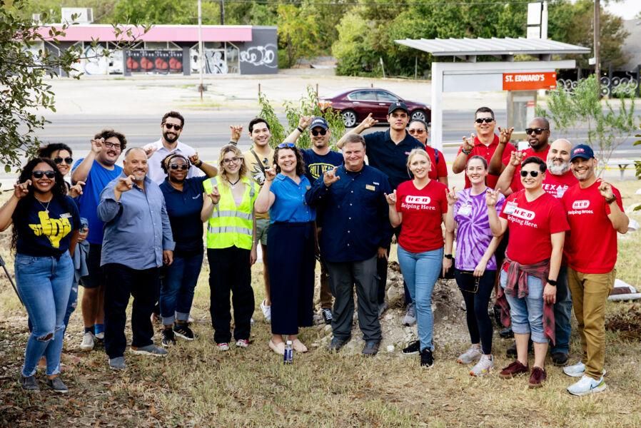 Hilltoppers and H-E-B volunteers planting trees near South Congress Avenue bus stop.