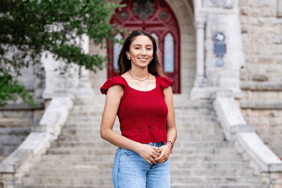 Hailee Alvarez poses in front of Main Building