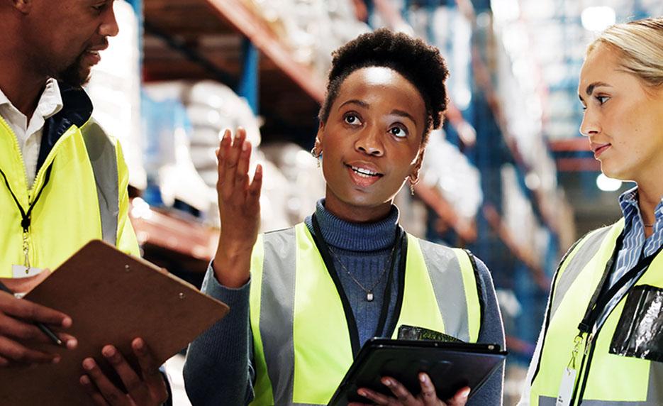 Warehouse supervisor collaborates with coworkers