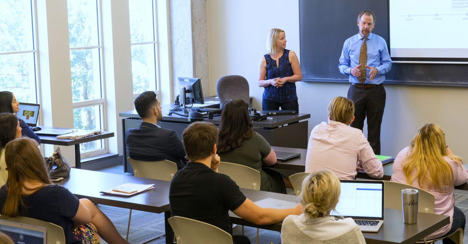 Graduate MBA Students in class with professor