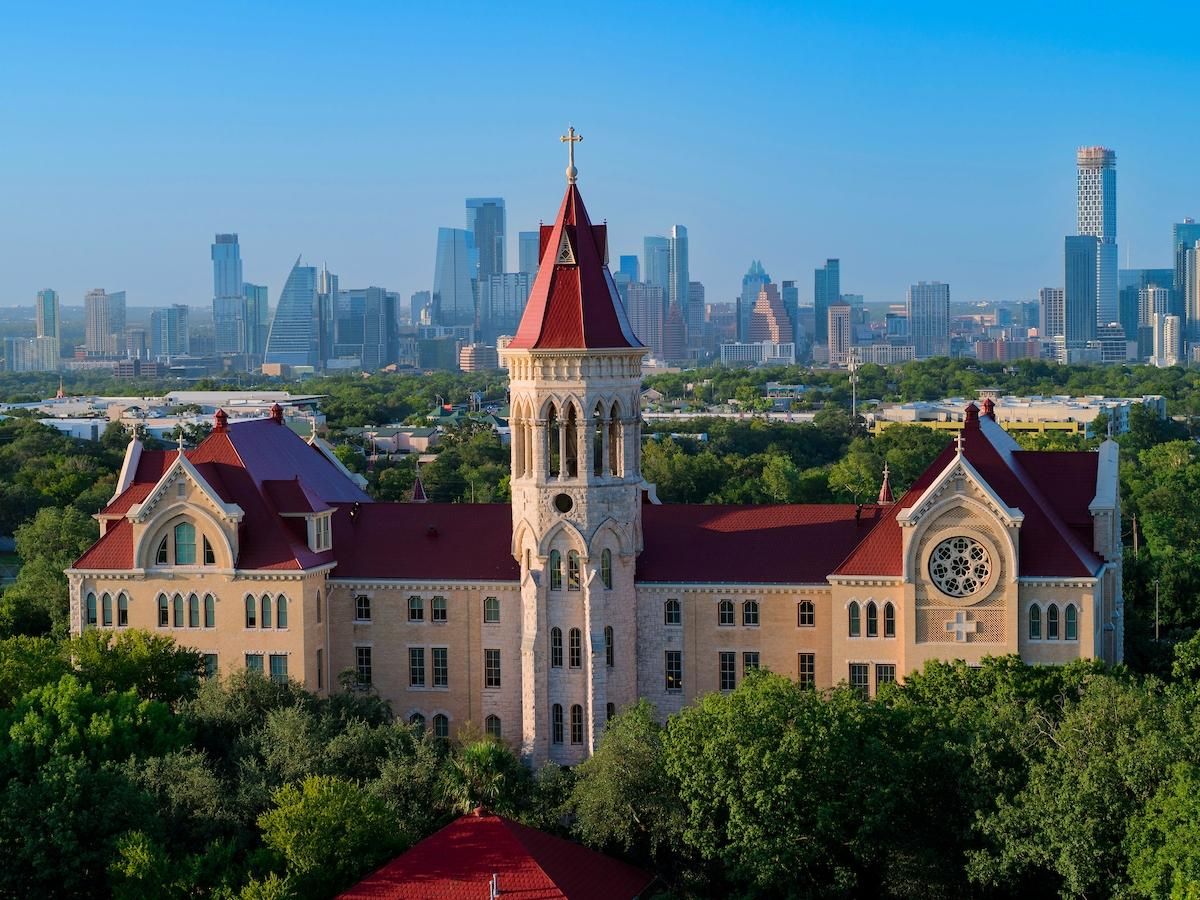 Main Building against Austin skyline