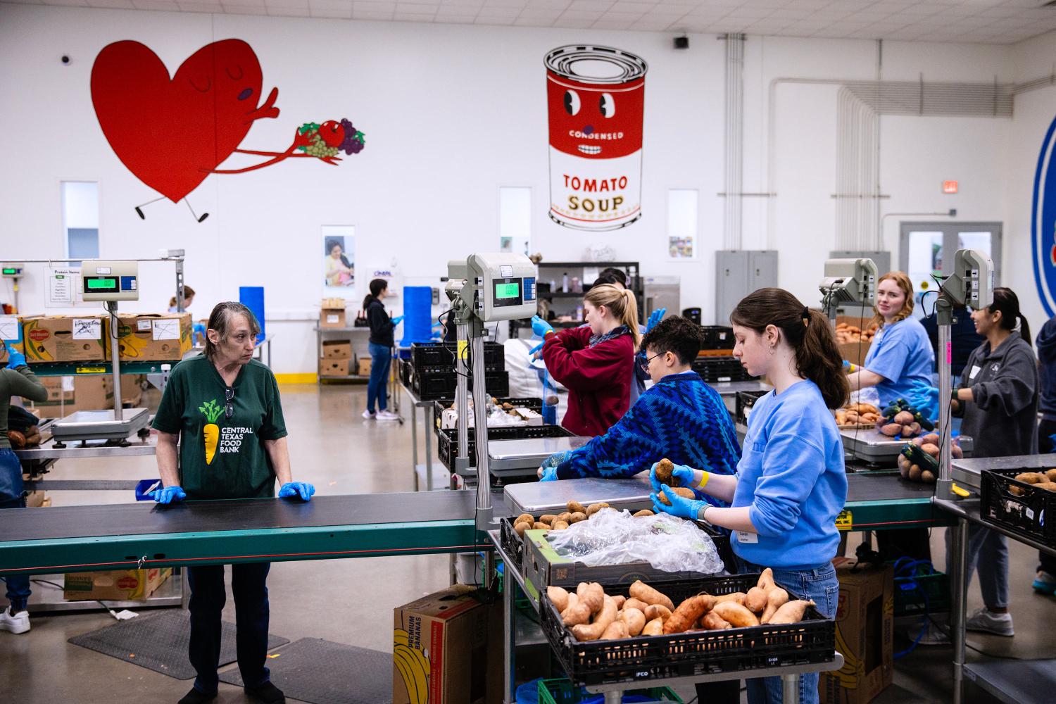 Students lend a hand at a food bank for The Big Event.